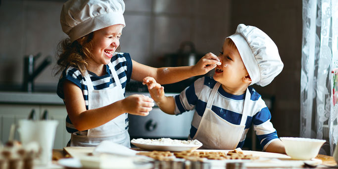 happy family funny kids are preparing the dough