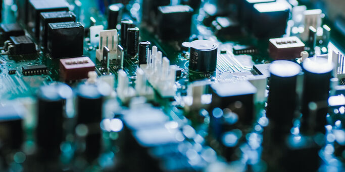 Close-up Macro Shot of Electronic Printed Circuit Board with Microchips